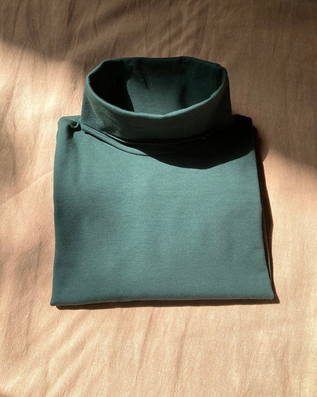 Col roulé vert bouteille