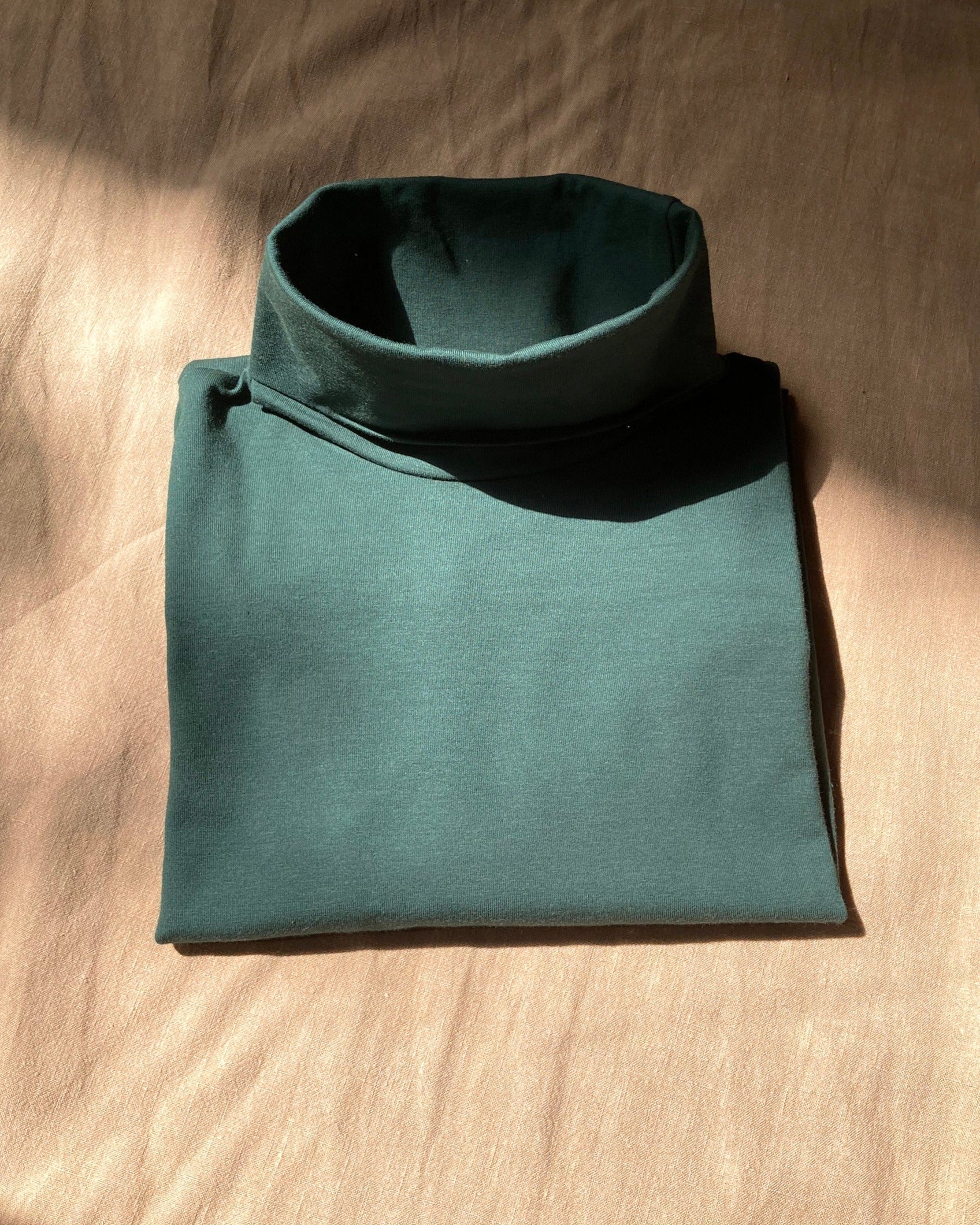 Col roulé vert bouteille