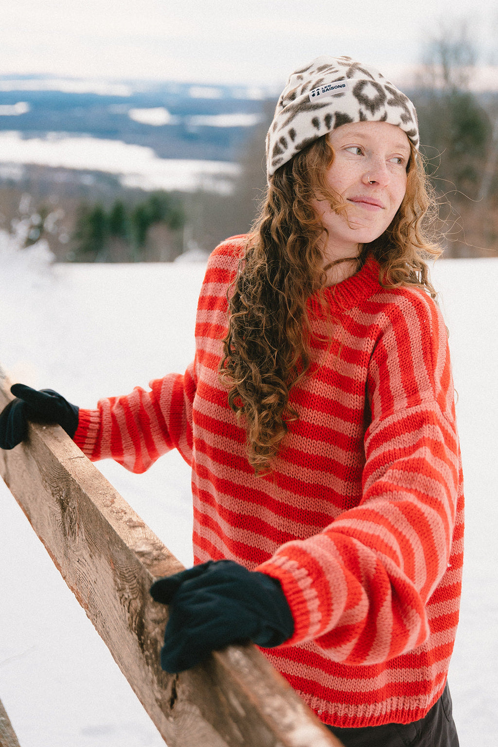 girl outside wearing the Les Saisons wool stripped orange sweater in winter