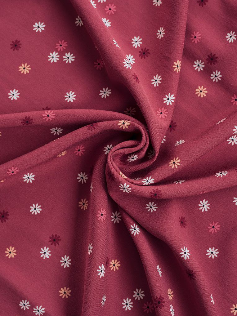 Jupe nouée à motifs de marguerites roses rubis